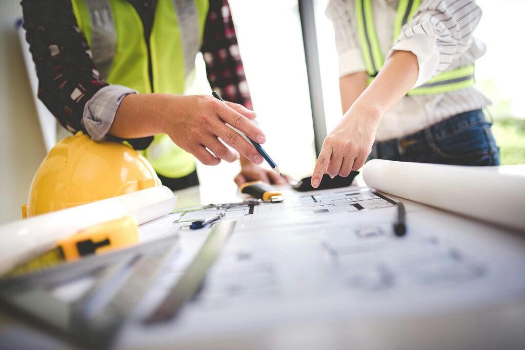 architect concept, working architect with blueprints in office to present to customers